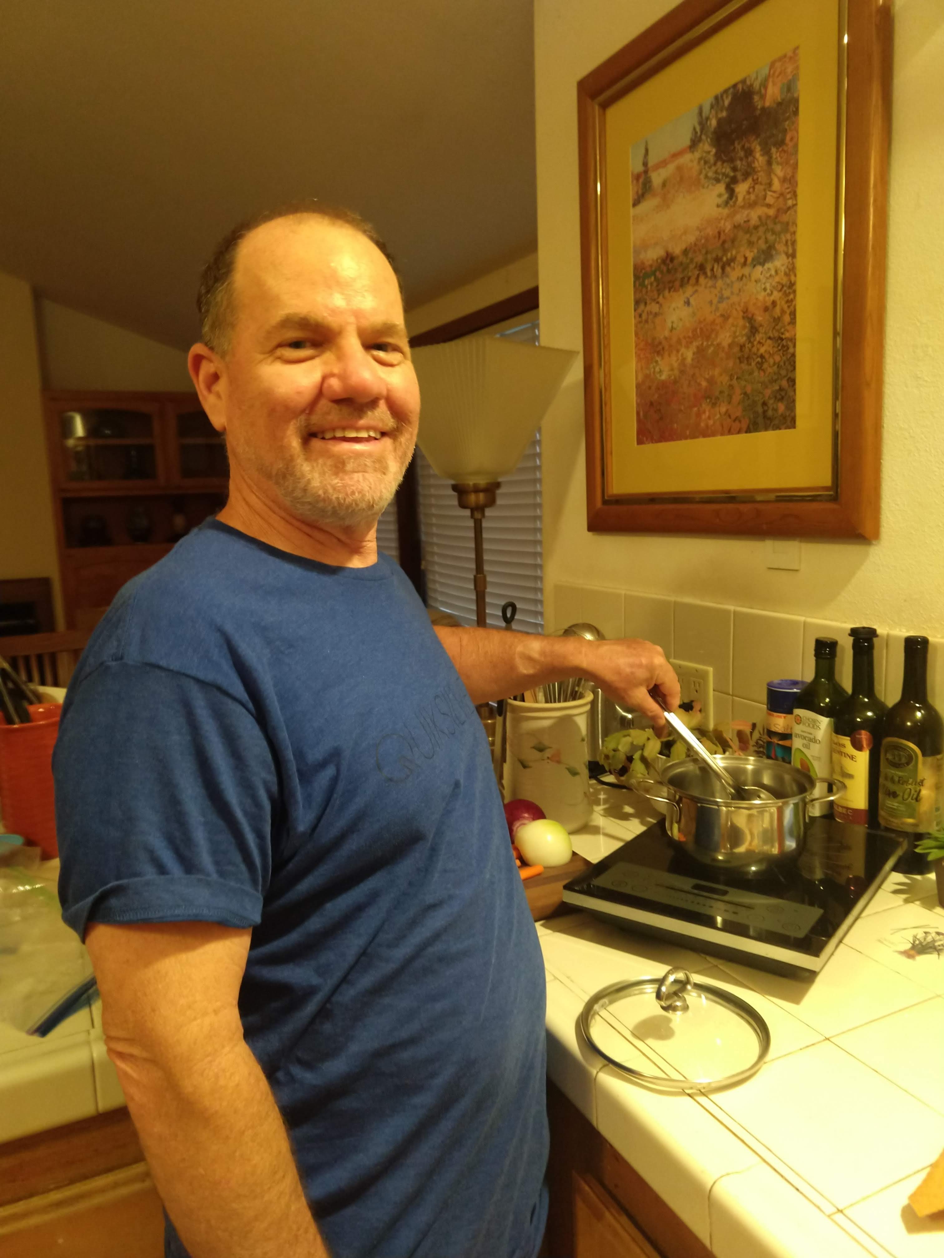 Man in front of Induction Stove